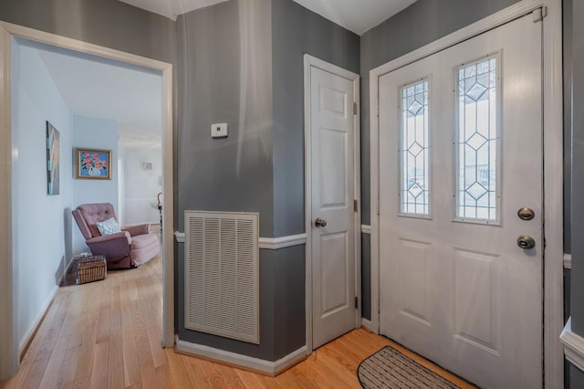 entryway with light hardwood / wood-style flooring