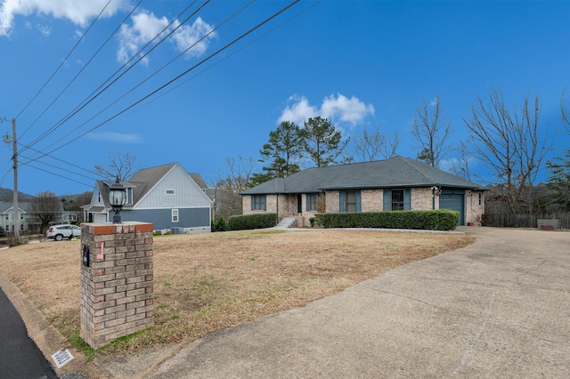 view of front of house with a garage and a front yard