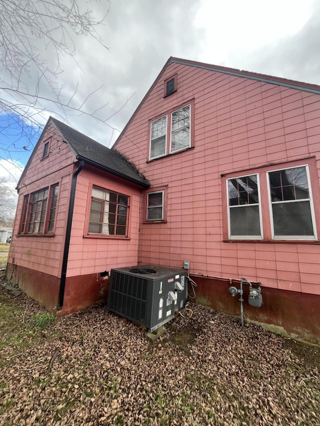 view of side of property with central AC