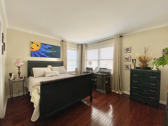 bedroom with ornamental molding and dark hardwood / wood-style floors