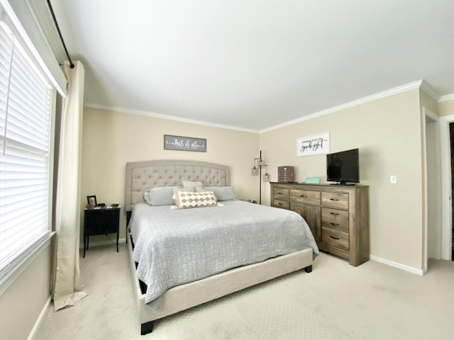 carpeted bedroom with ornamental molding