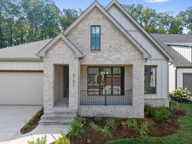 modern farmhouse style home with a garage and a porch