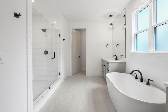 bathroom featuring shower with separate bathtub, a healthy amount of sunlight, vanity, and tile patterned floors