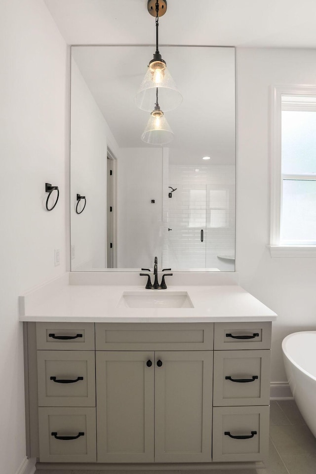 bathroom featuring vanity, shower with separate bathtub, and tile patterned flooring