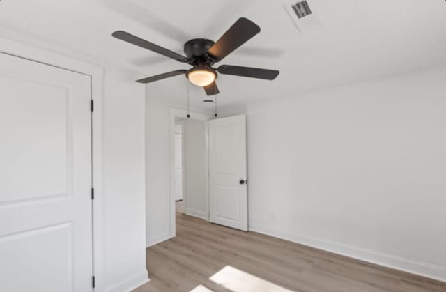 unfurnished bedroom with light hardwood / wood-style floors and ceiling fan