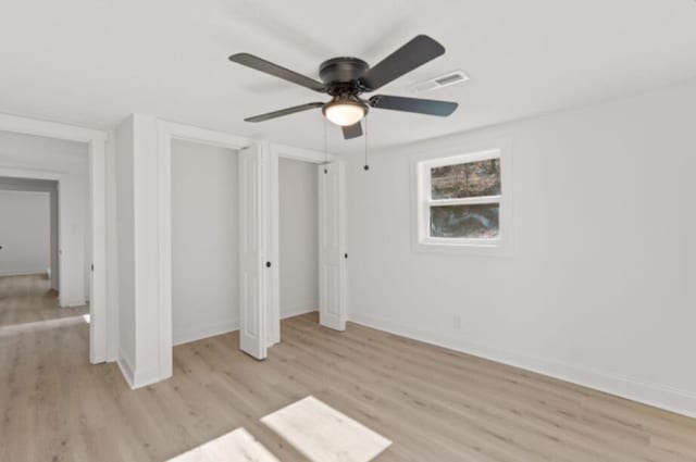 unfurnished bedroom featuring ceiling fan and light hardwood / wood-style flooring