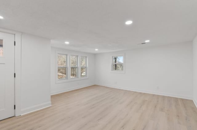 spare room with light hardwood / wood-style floors