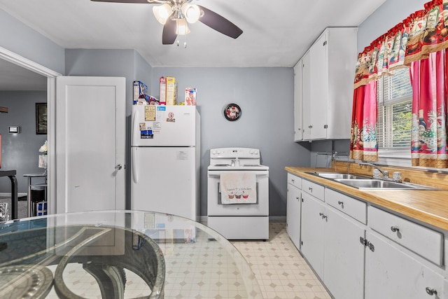 kitchen with white cabinetry, sink, white appliances, and ceiling fan