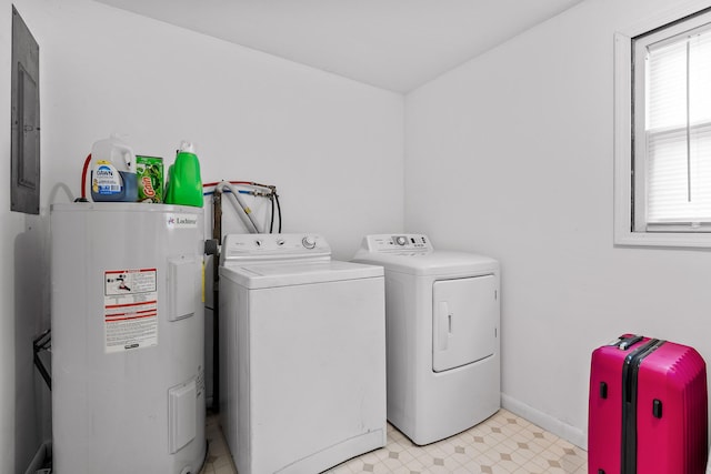 clothes washing area featuring water heater and separate washer and dryer