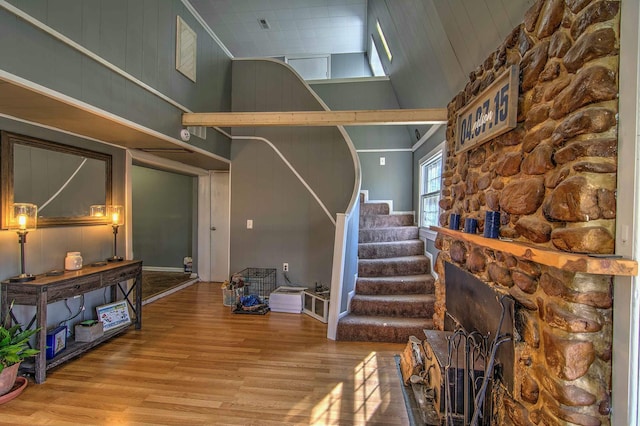 interior space featuring high vaulted ceiling and hardwood / wood-style floors