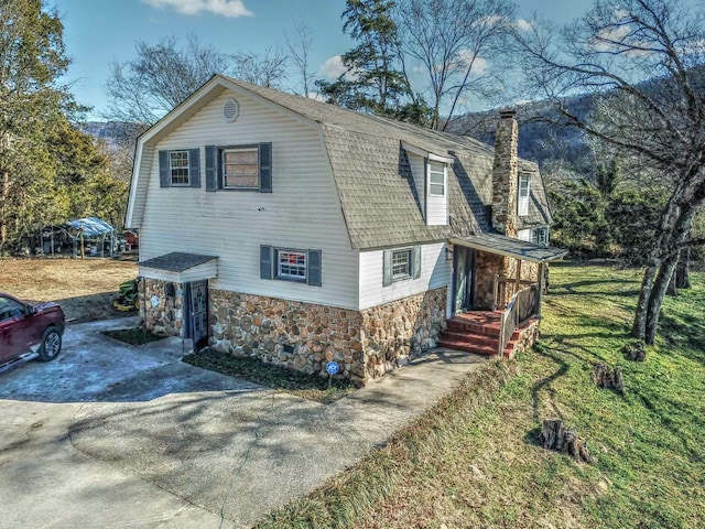 view of property exterior with a yard