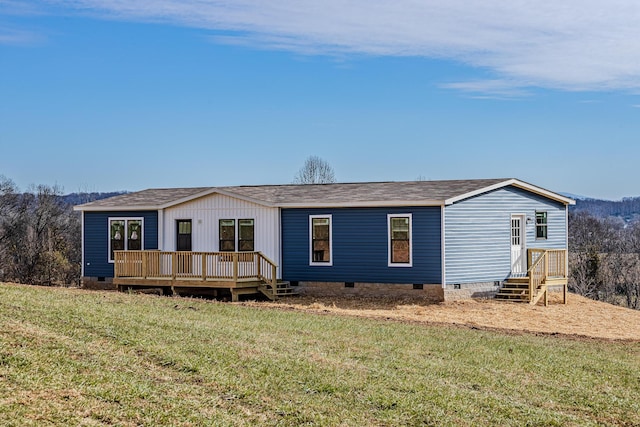 back of property featuring a yard and a deck