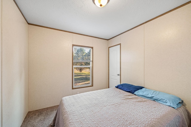 carpeted bedroom with crown molding and a textured ceiling