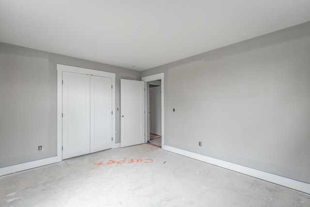 unfurnished bedroom with a closet