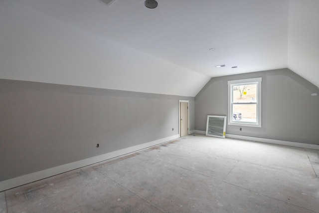 additional living space with lofted ceiling