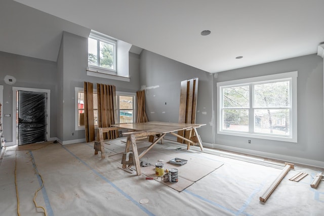 misc room featuring a healthy amount of sunlight and a high ceiling