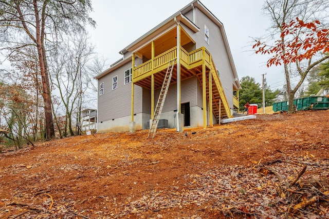 back of property with a balcony