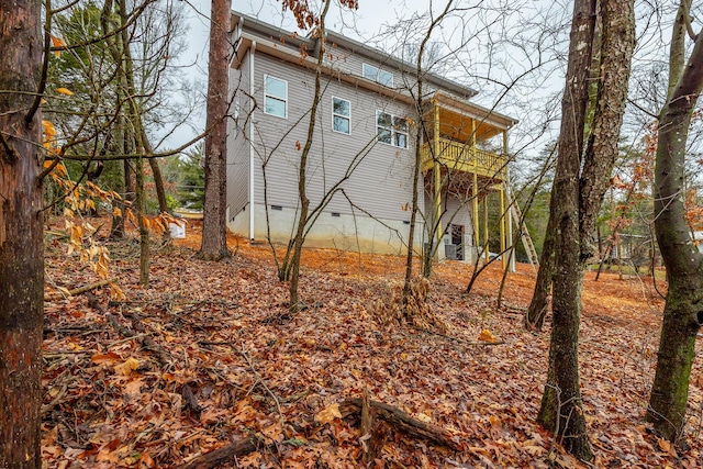 view of home's exterior with a balcony