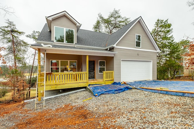 view of front of house with a garage and covered porch