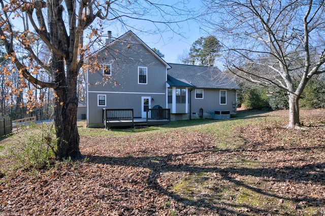 back of house featuring a deck