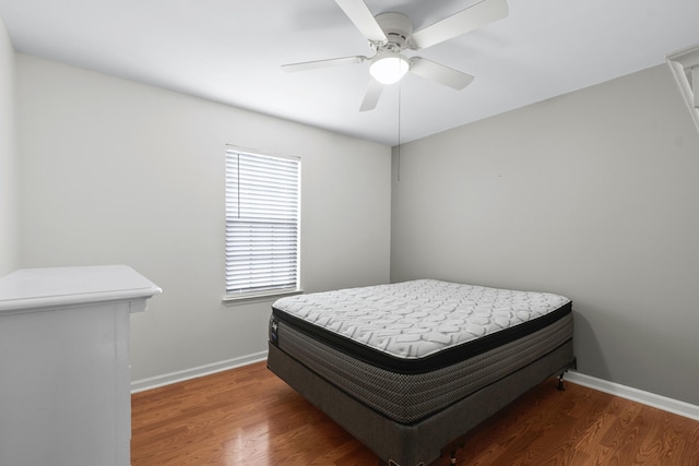 bedroom featuring dark wood-type flooring and ceiling fan