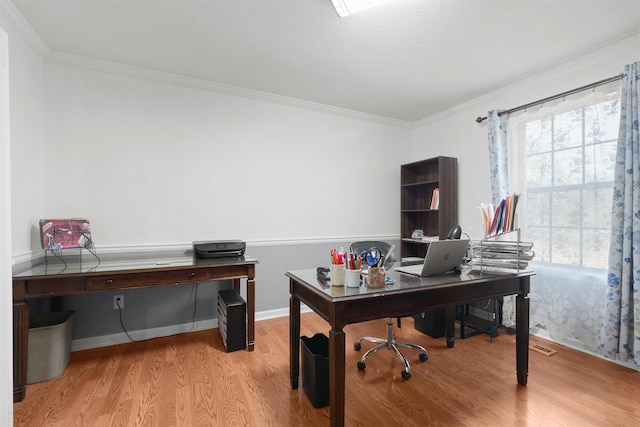 office space featuring crown molding and light wood-type flooring