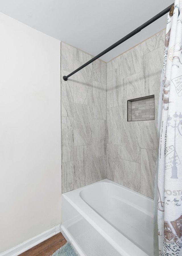 bathroom featuring shower / bath combo and wood-type flooring