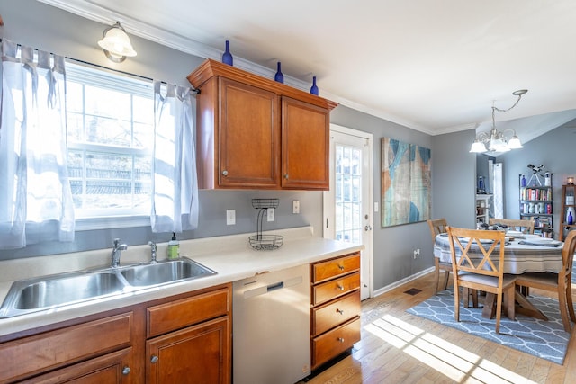 kitchen with sink, crown molding, dishwasher, a notable chandelier, and light hardwood / wood-style floors