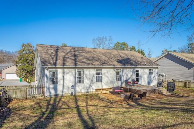 rear view of property with a yard and a deck