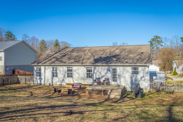 back of property featuring a yard