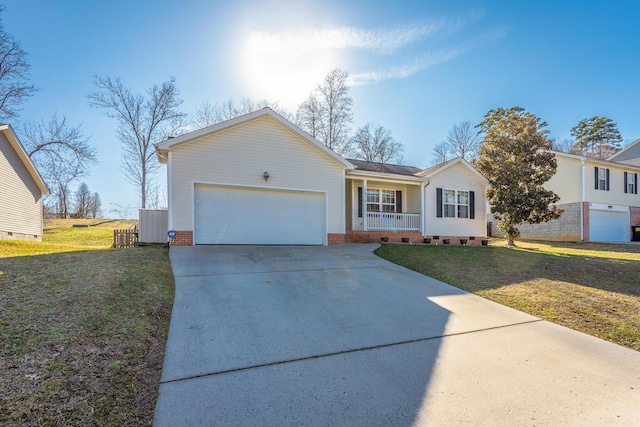 single story home with a garage, a front lawn, and covered porch