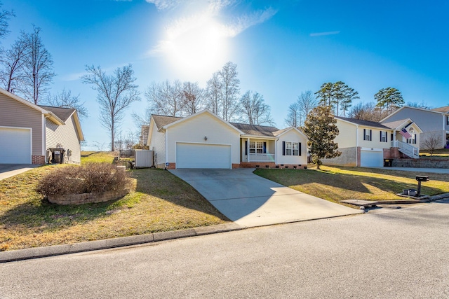 view of front facade with a garage, central AC unit, and a front yard