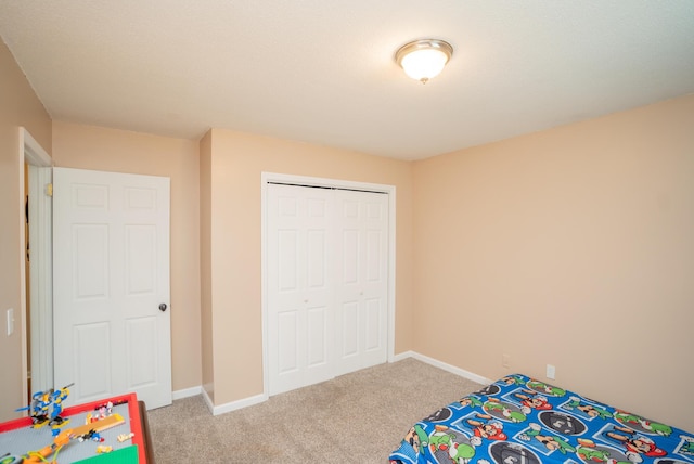 carpeted bedroom with a closet