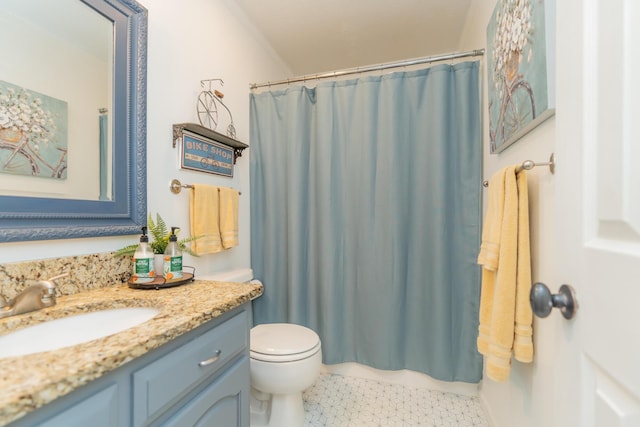 bathroom featuring vanity, curtained shower, and toilet