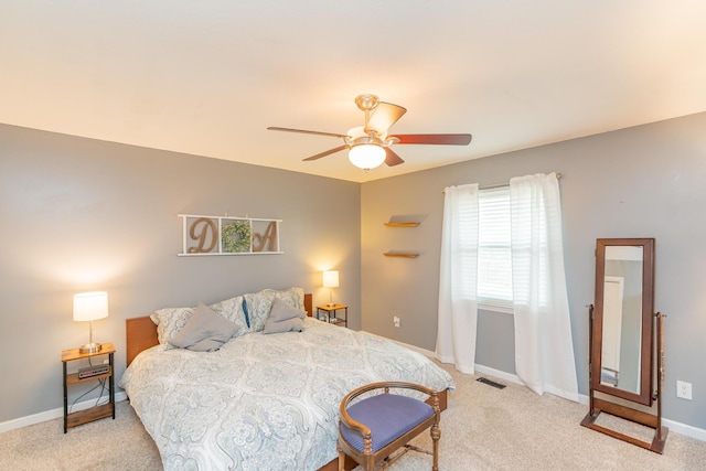 bedroom with light colored carpet and ceiling fan