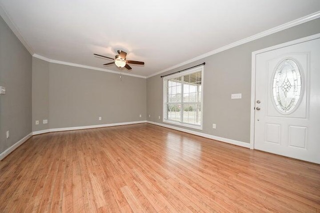 foyer with ceiling fan, ornamental molding, and light wood-type flooring