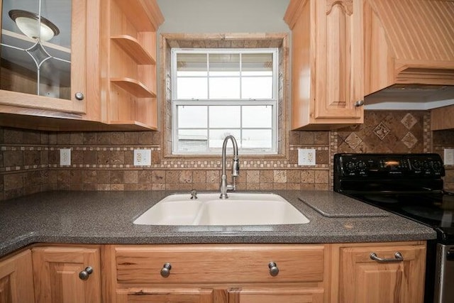 kitchen with tasteful backsplash, black electric range oven, sink, and light brown cabinets