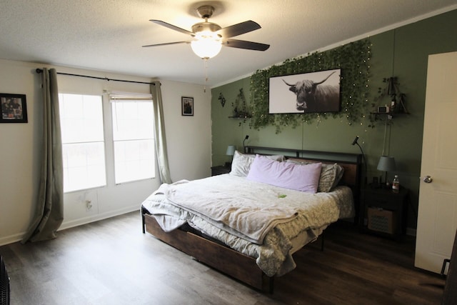 bedroom with lofted ceiling, dark hardwood / wood-style floors, and ceiling fan