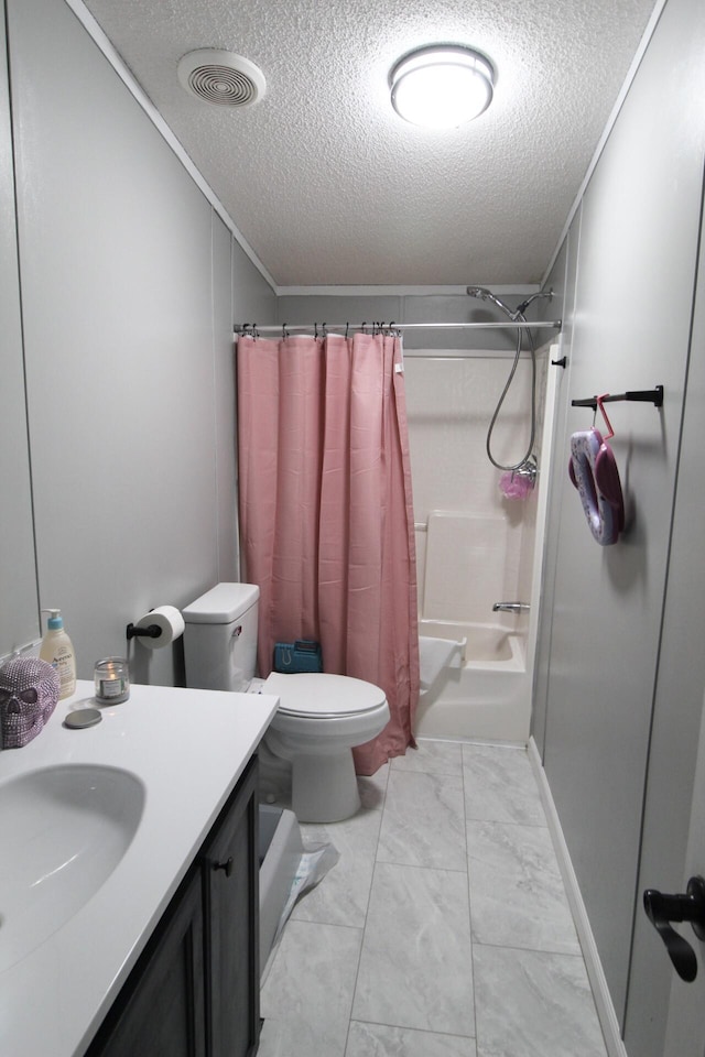 full bathroom featuring ornamental molding, vanity, shower / tub combo, toilet, and a textured ceiling