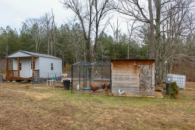 view of outbuilding with a yard