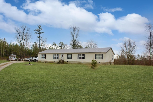 view of front of house featuring a front lawn, metal roof, and crawl space