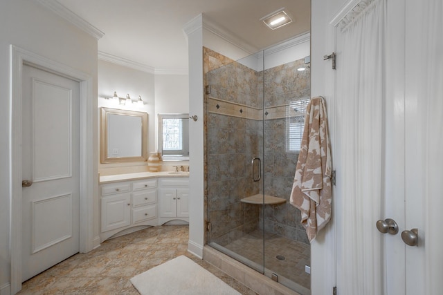 bathroom with vanity, an enclosed shower, and crown molding