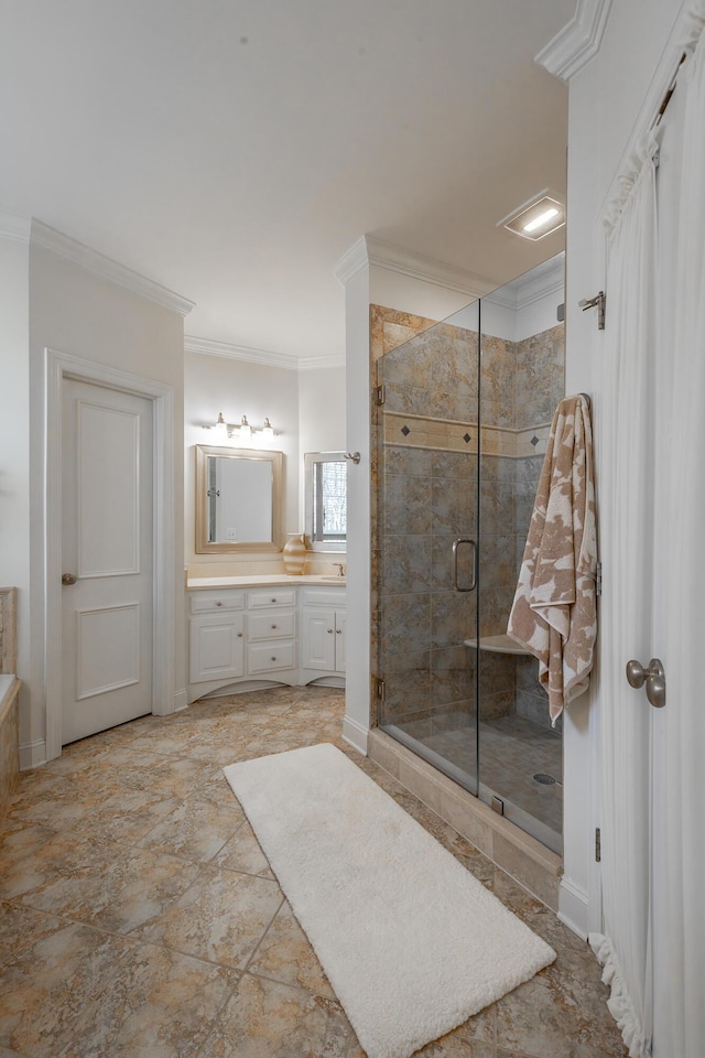 bathroom with vanity, ornamental molding, and an enclosed shower