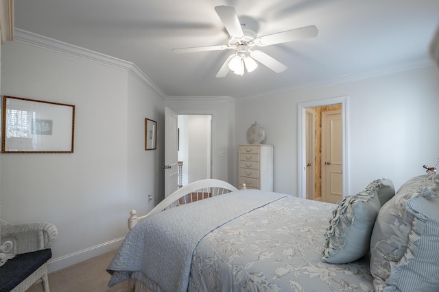 bedroom featuring ornamental molding, ceiling fan, and carpet flooring