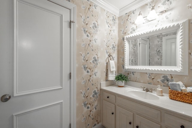 bathroom with crown molding and vanity