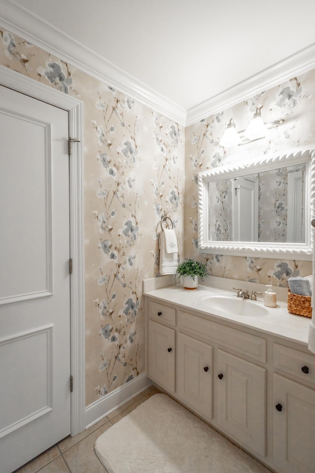 bathroom featuring tile patterned flooring, ornamental molding, and vanity