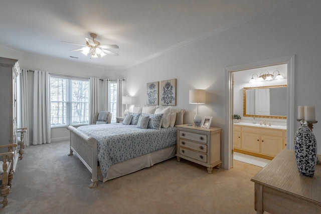 carpeted bedroom featuring sink, crown molding, ensuite bath, and ceiling fan