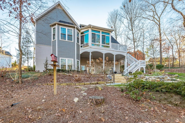 view of front of house featuring a sunroom