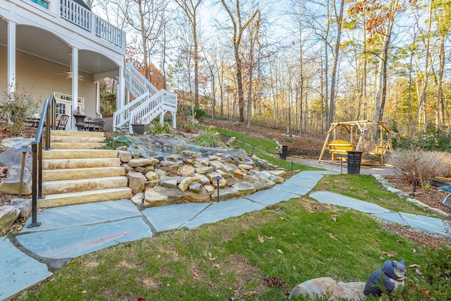 view of yard featuring ceiling fan