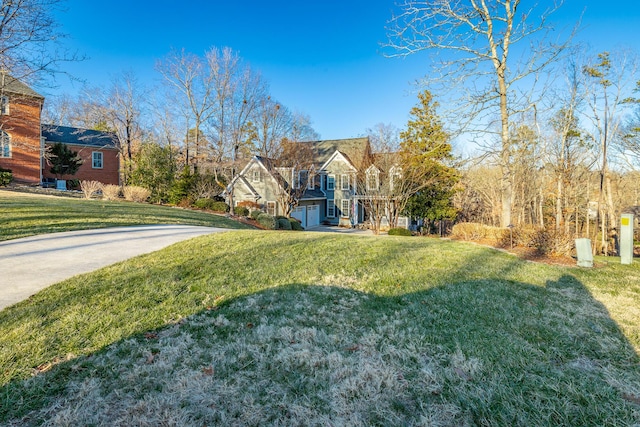 view of front of house with a garage and a front yard